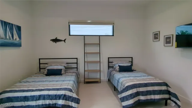 a bedroom with a bed and a lamp on table