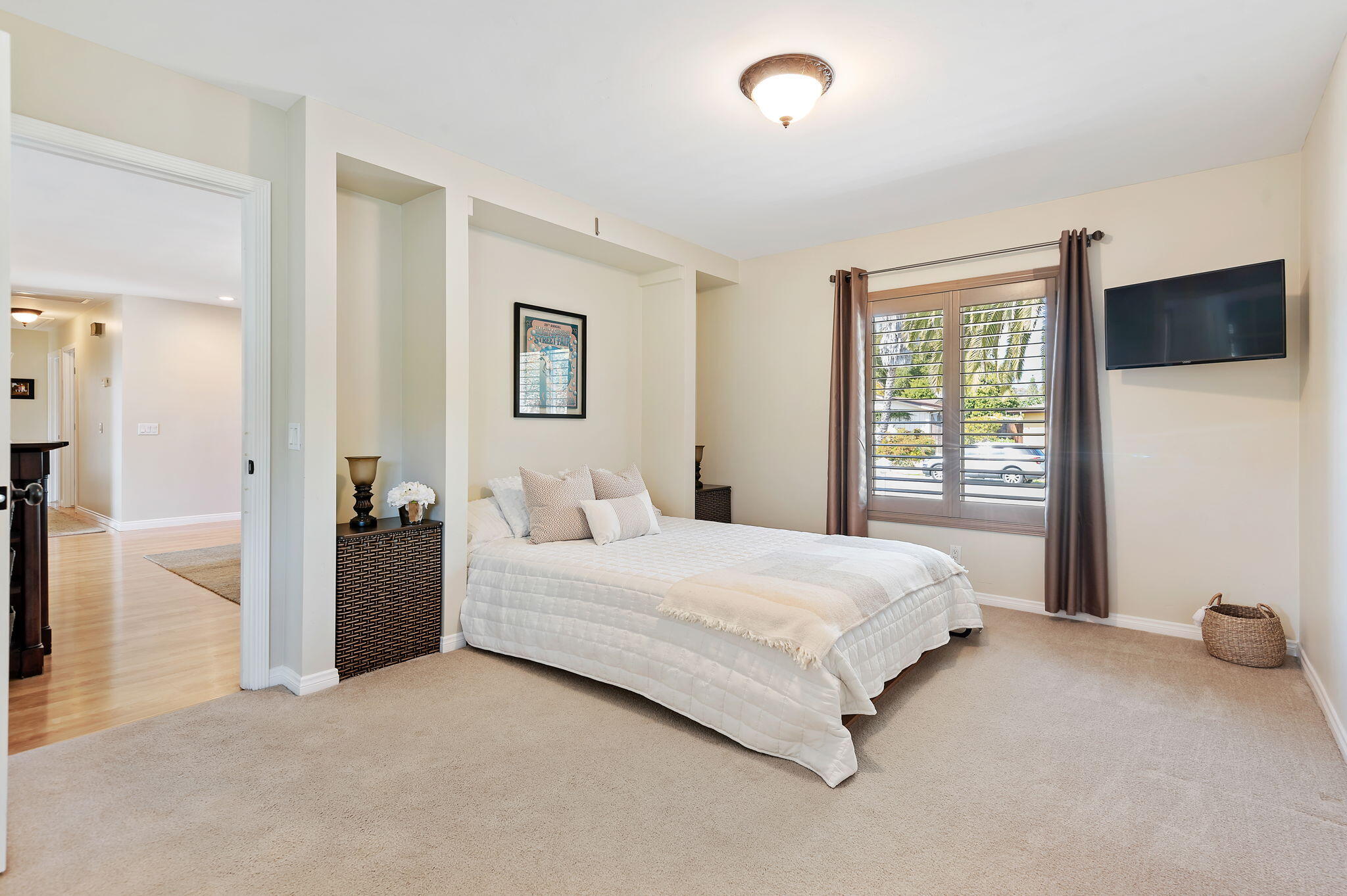 7635 Anchor Drive Goleta, CA 93117 - Photo 15 of 24 a bedroom with a bed and a flat screen tv