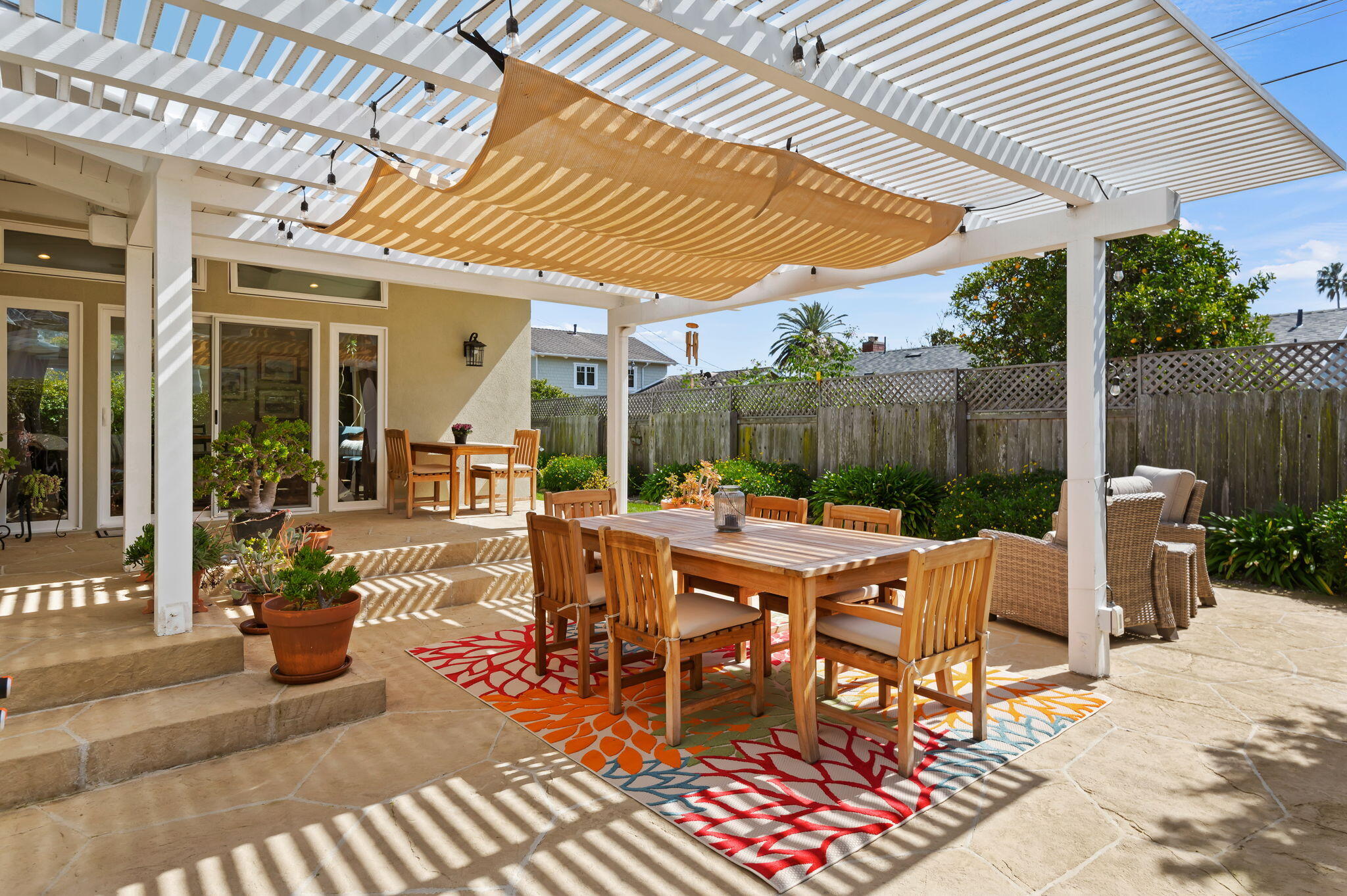 7635 Anchor Drive Goleta, CA 93117 - Photo 16 of 24 a view of a patio with a dining table and chairs