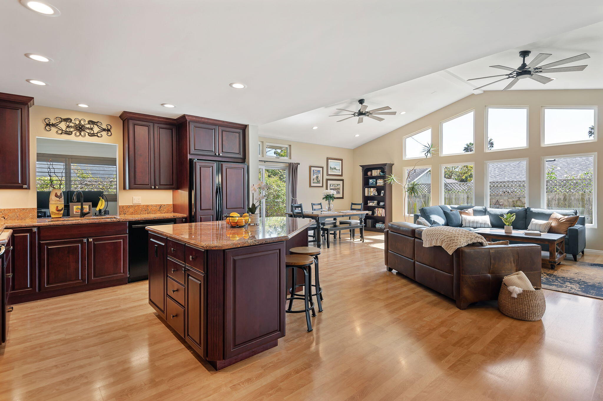 7635 Anchor Drive Goleta, CA 93117 - Photo 6 of 24 a large kitchen with stainless steel appliances granite countertop a lot of cabinets and couches