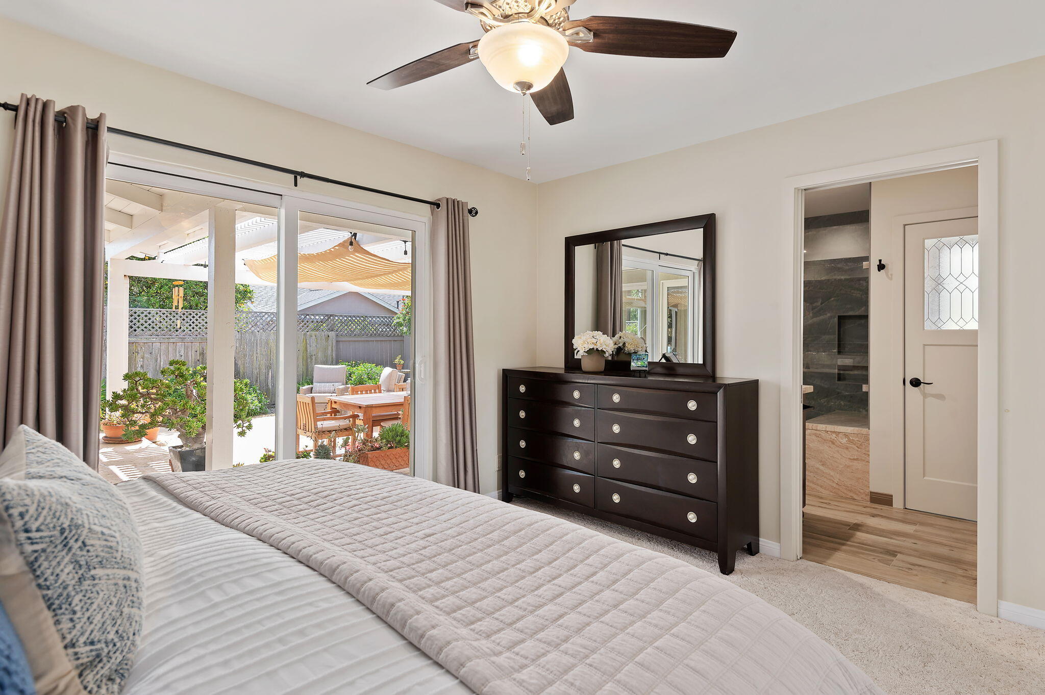 7635 Anchor Drive Goleta, CA 93117 - Photo 9 of 24 a bedroom with a bed and a large window