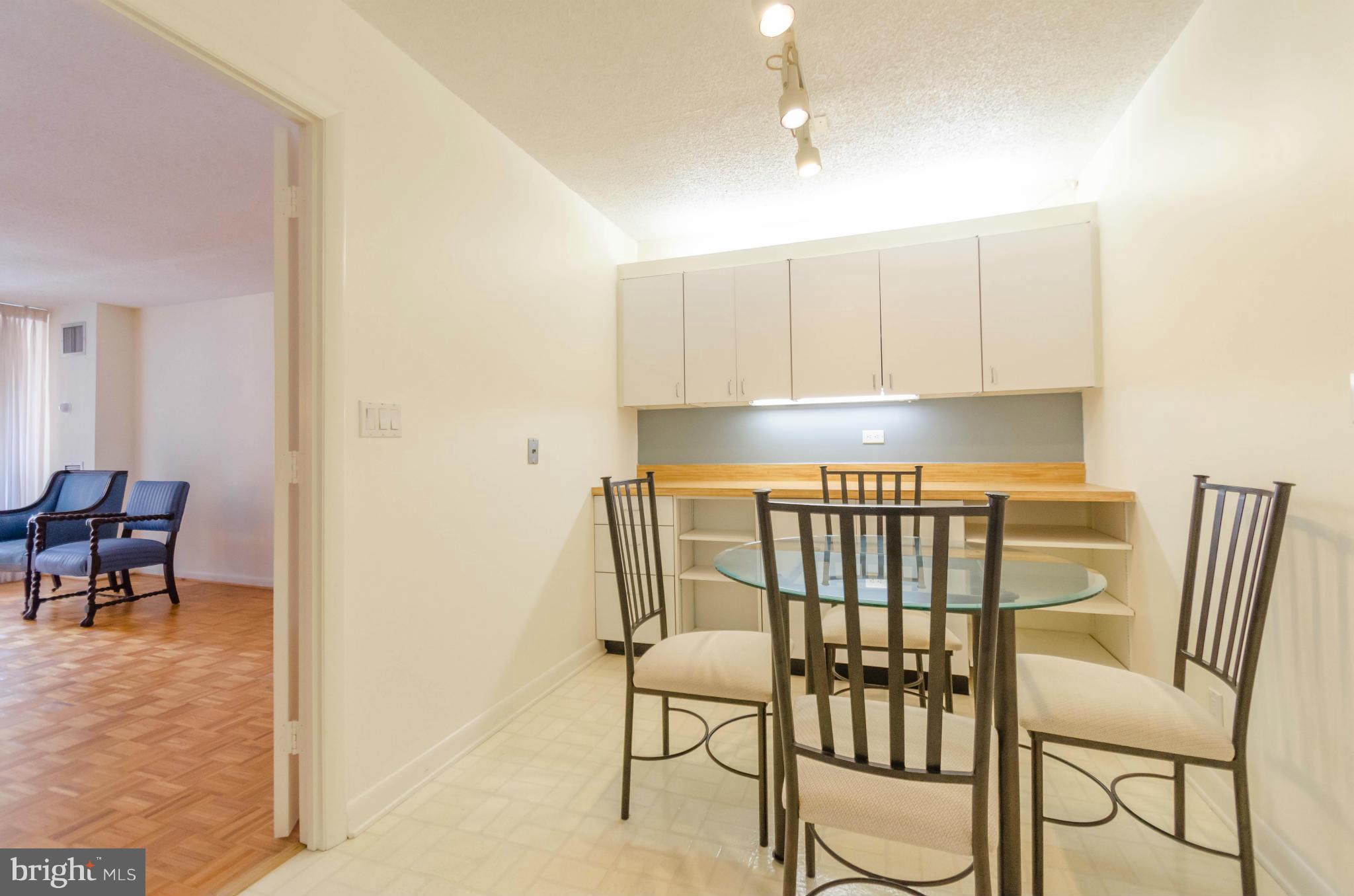 111 Hamlet Hill Road, Unit 606 Baltimore, MD 21210 - Photo 11 of 22 a view of a dining room with furniture