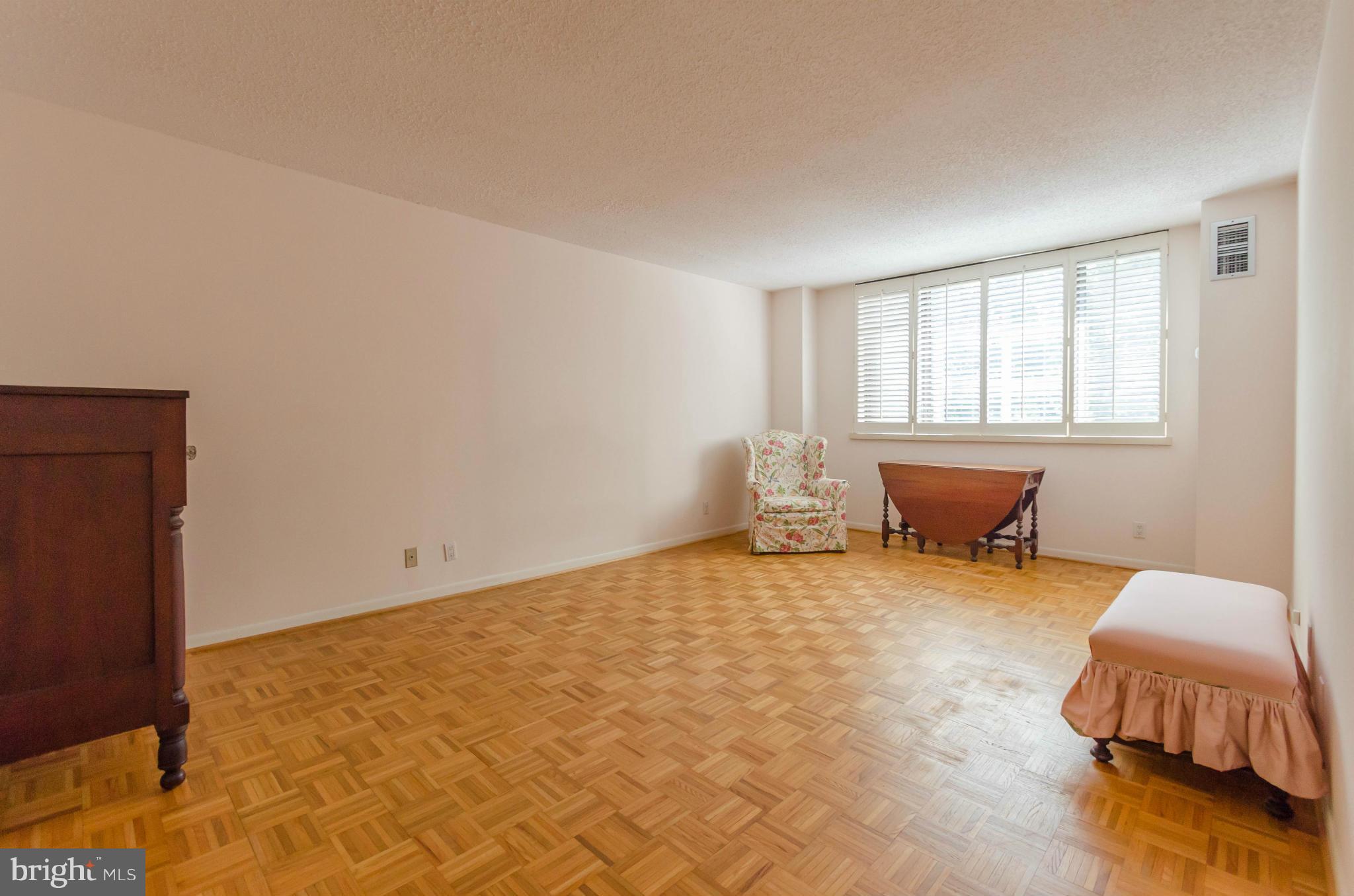 111 Hamlet Hill Road, Unit 606 Baltimore, MD 21210 - Photo 14 of 22 a living room with furniture and a window