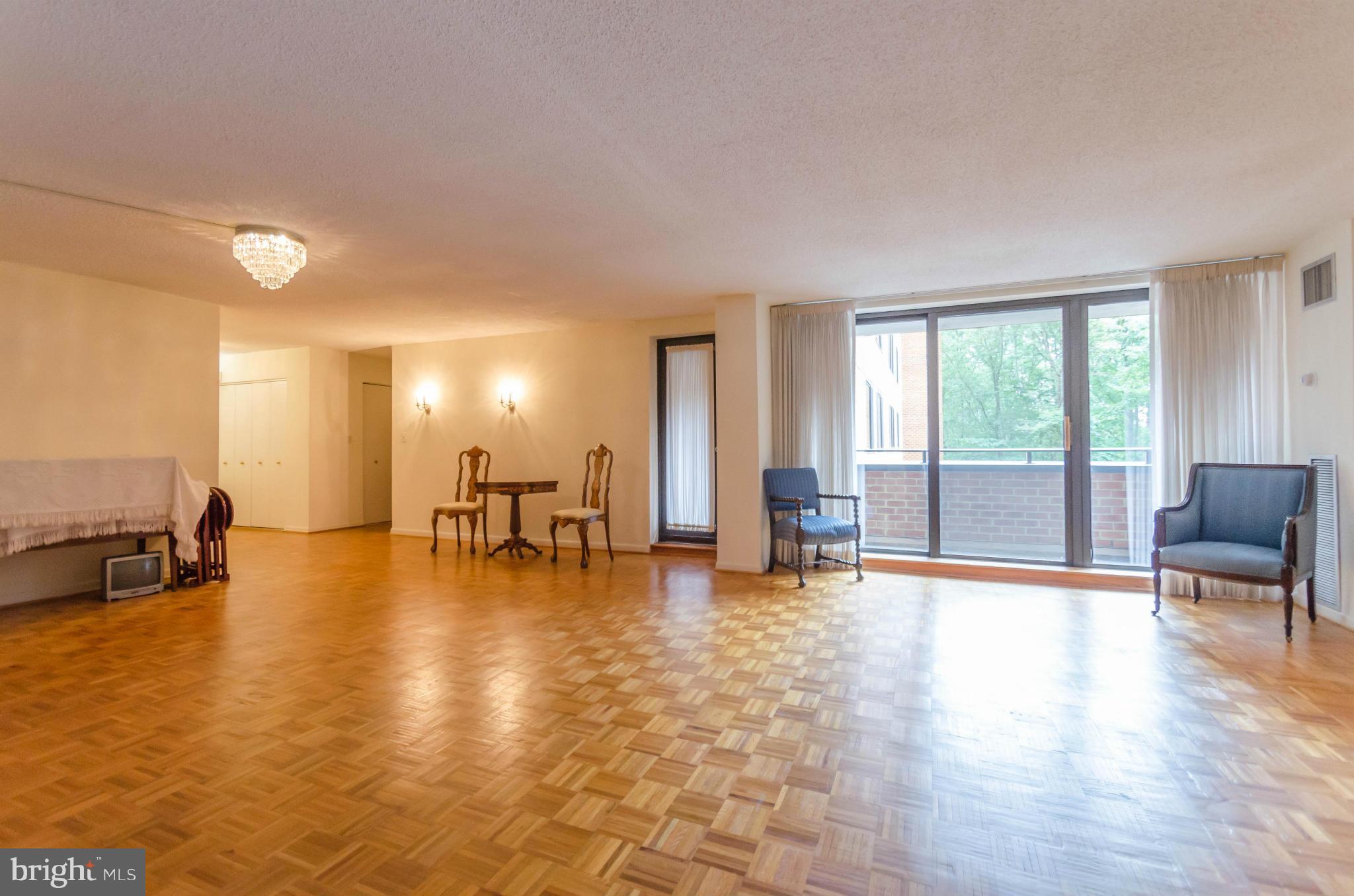 111 Hamlet Hill Road, Unit 606 Baltimore, MD 21210 - Photo 5 of 22 a view of an empty room with window and a kitchen view