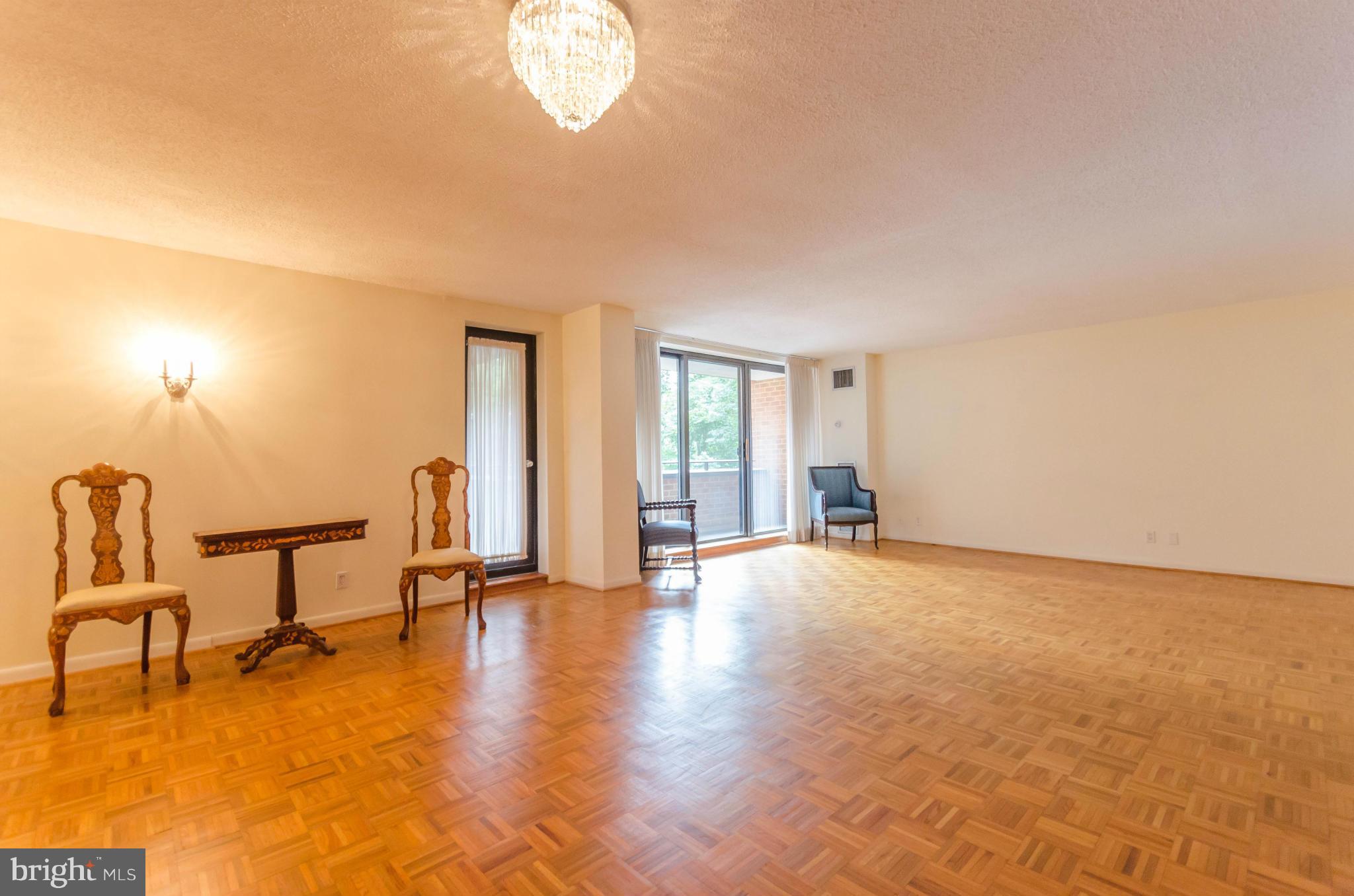 111 Hamlet Hill Road, Unit 606 Baltimore, MD 21210 - Photo 6 of 22 a view of a livingroom with a furniture and a chandelier