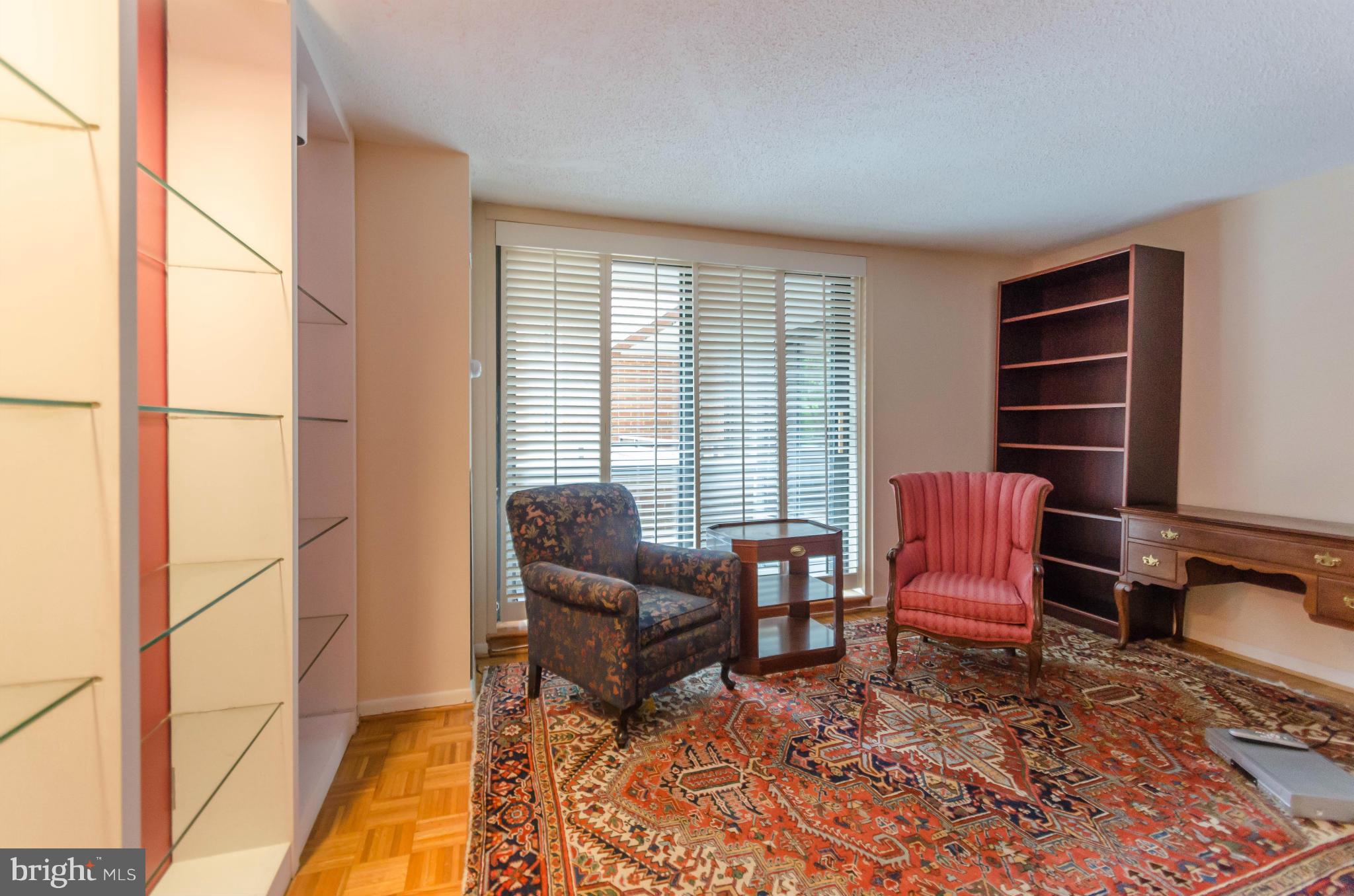 111 Hamlet Hill Road, Unit 606 Baltimore, MD 21210 - Photo 9 of 22 a living room with furniture and a window