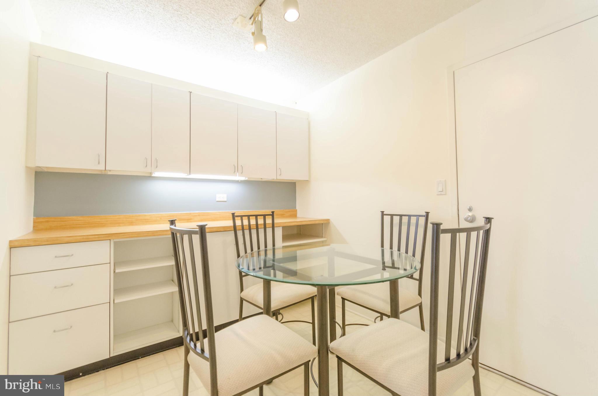 111 Hamlet Hill Road, Unit 606 Baltimore, MD 21210 - Photo 10 of 22 a view of cabinets and wooden floor