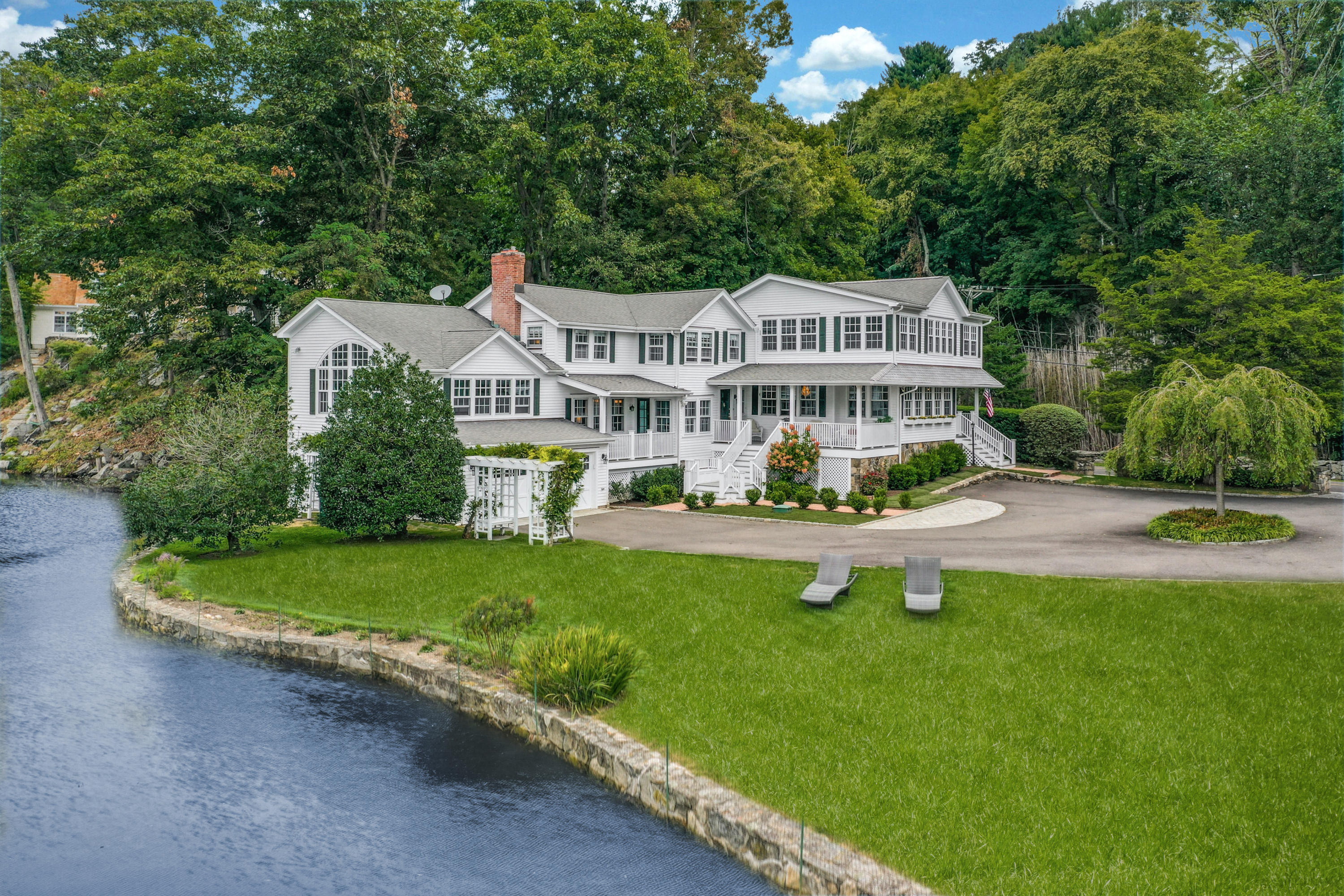 a front view of a house with a yard table and chairs