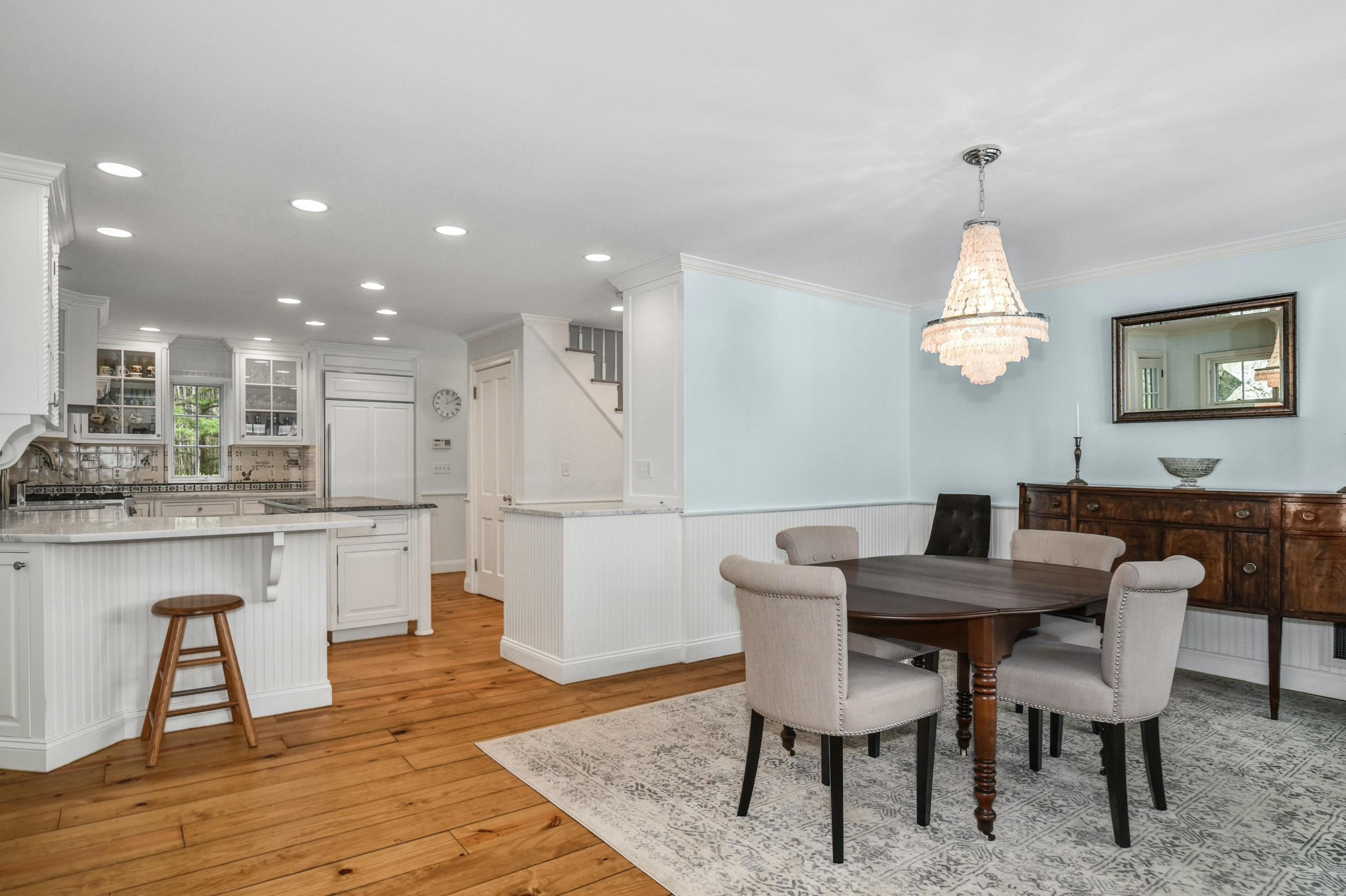 71 Goodwives River Road Darien, CT 06820 - Photo 17 of 39 a view of a dining room with furniture and wooden floor