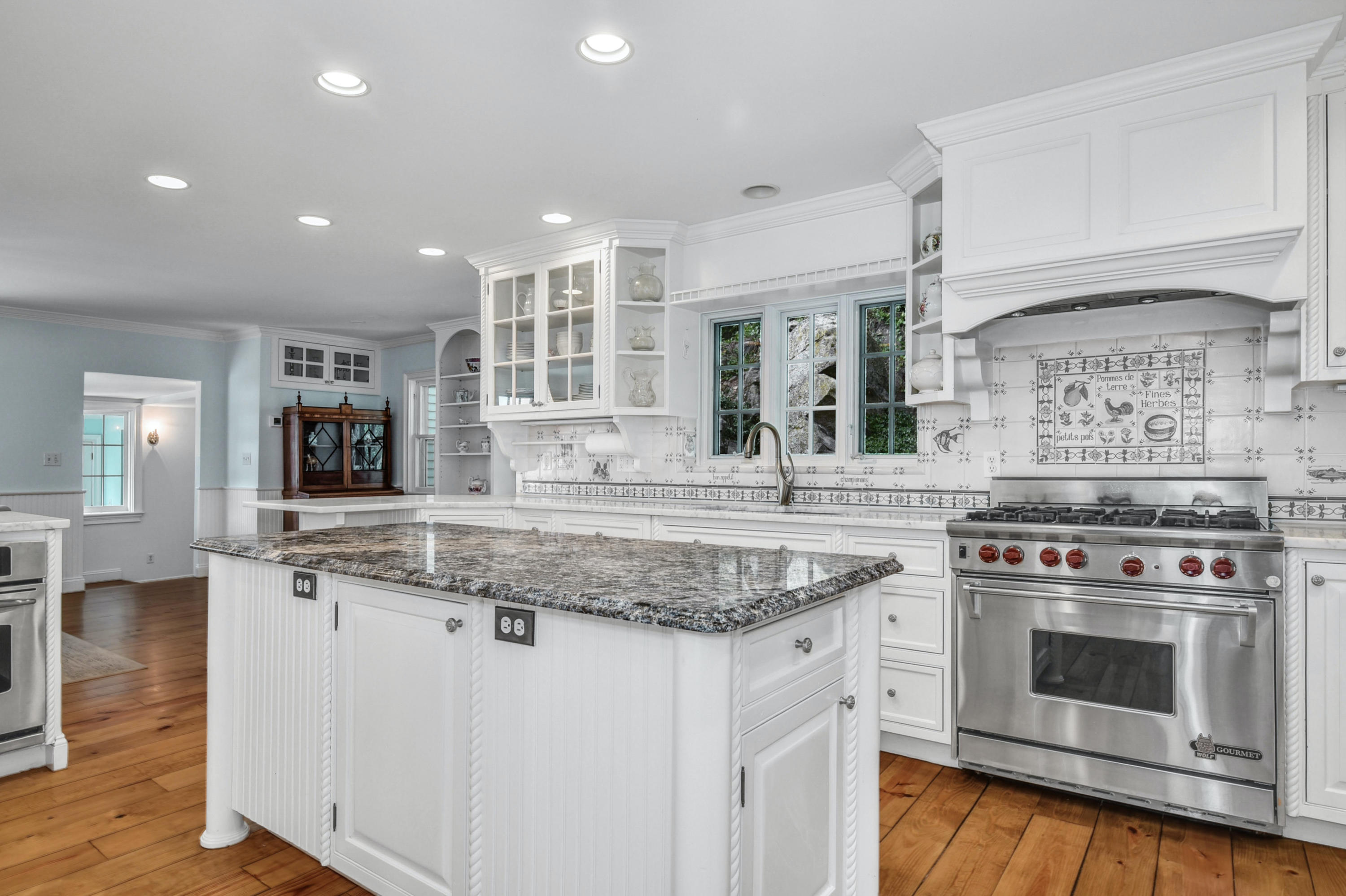 71 Goodwives River Road Darien, CT 06820 - Photo 19 of 39 a kitchen with stainless steel appliances granite countertop a stove and a sink