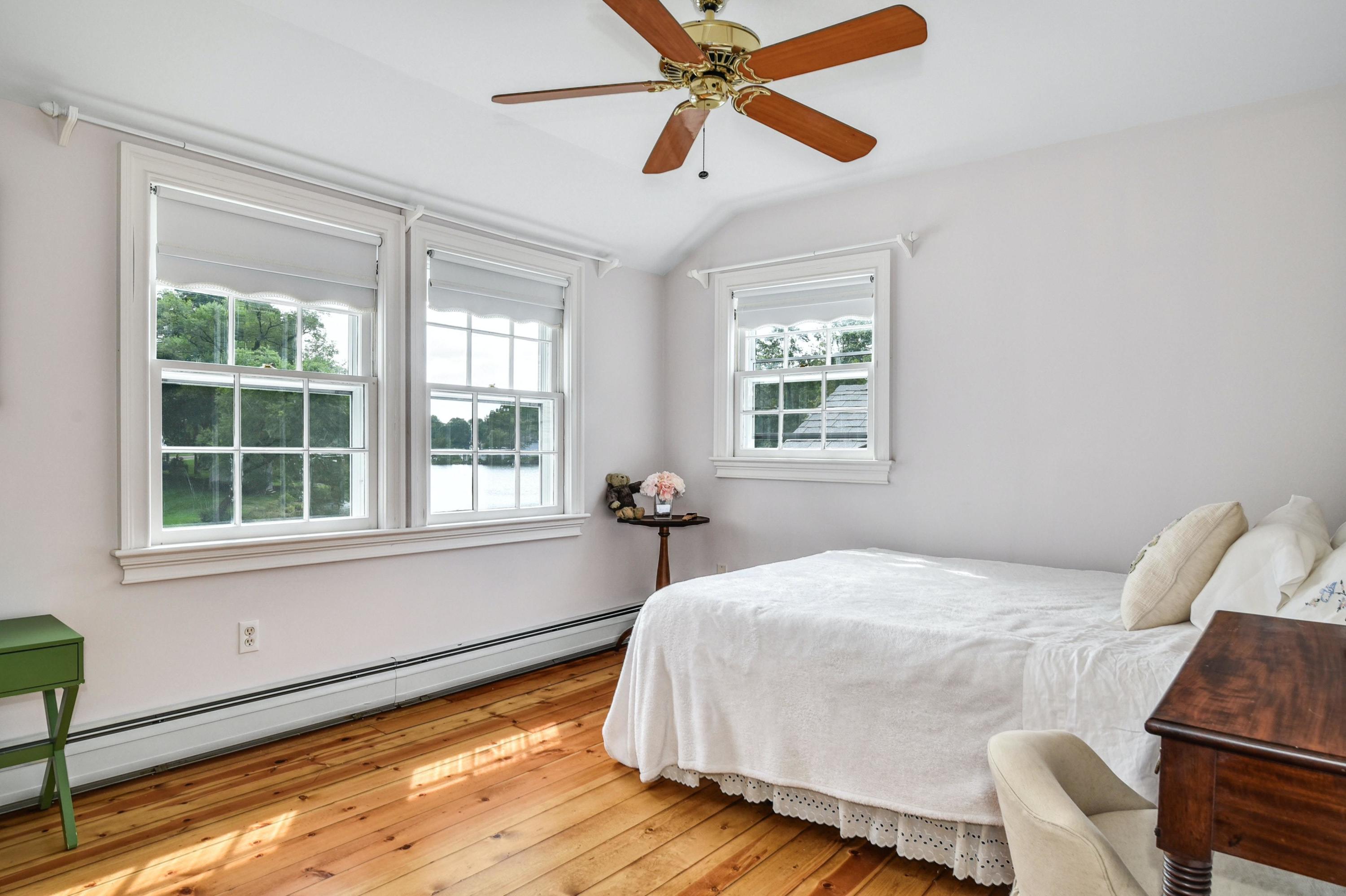 71 Goodwives River Road Darien, CT 06820 - Photo 31 of 39 a bedroom with a bed and wooden floor