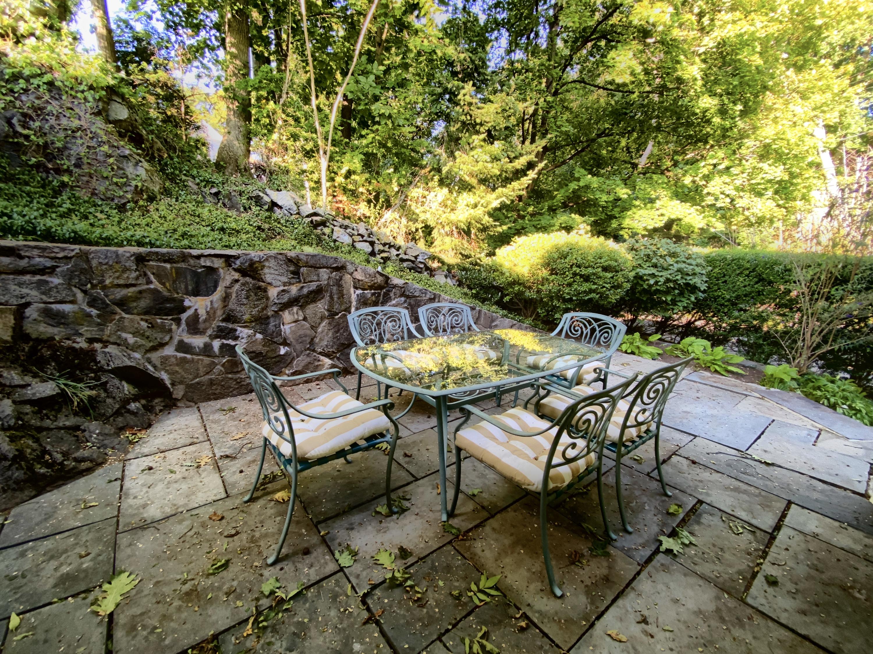 71 Goodwives River Road Darien, CT 06820 - Photo 37 of 39 a backyard of a house with table and chairs