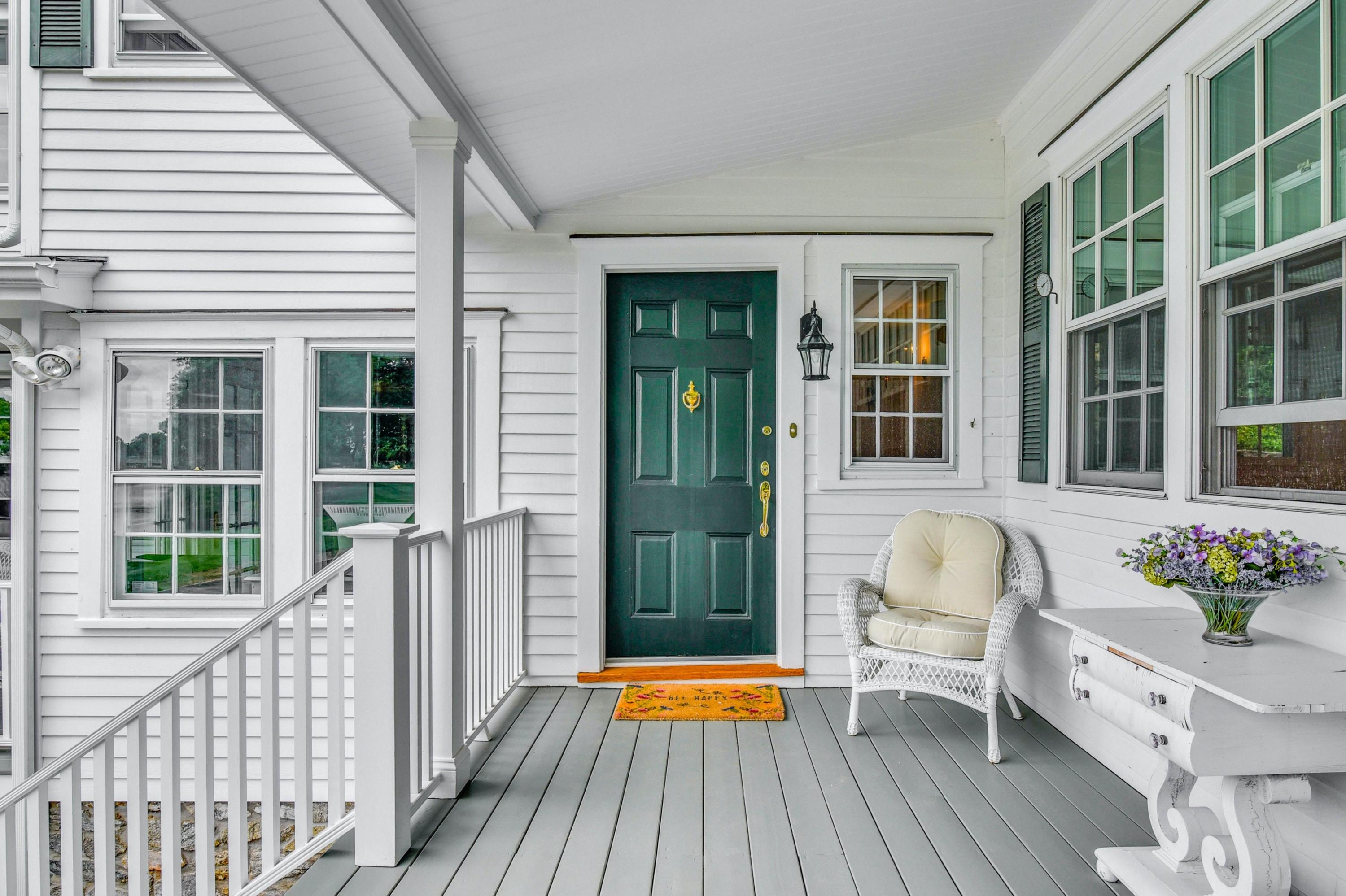 71 Goodwives River Road Darien, CT 06820 - Photo 9 of 39 a view of a house with a porch