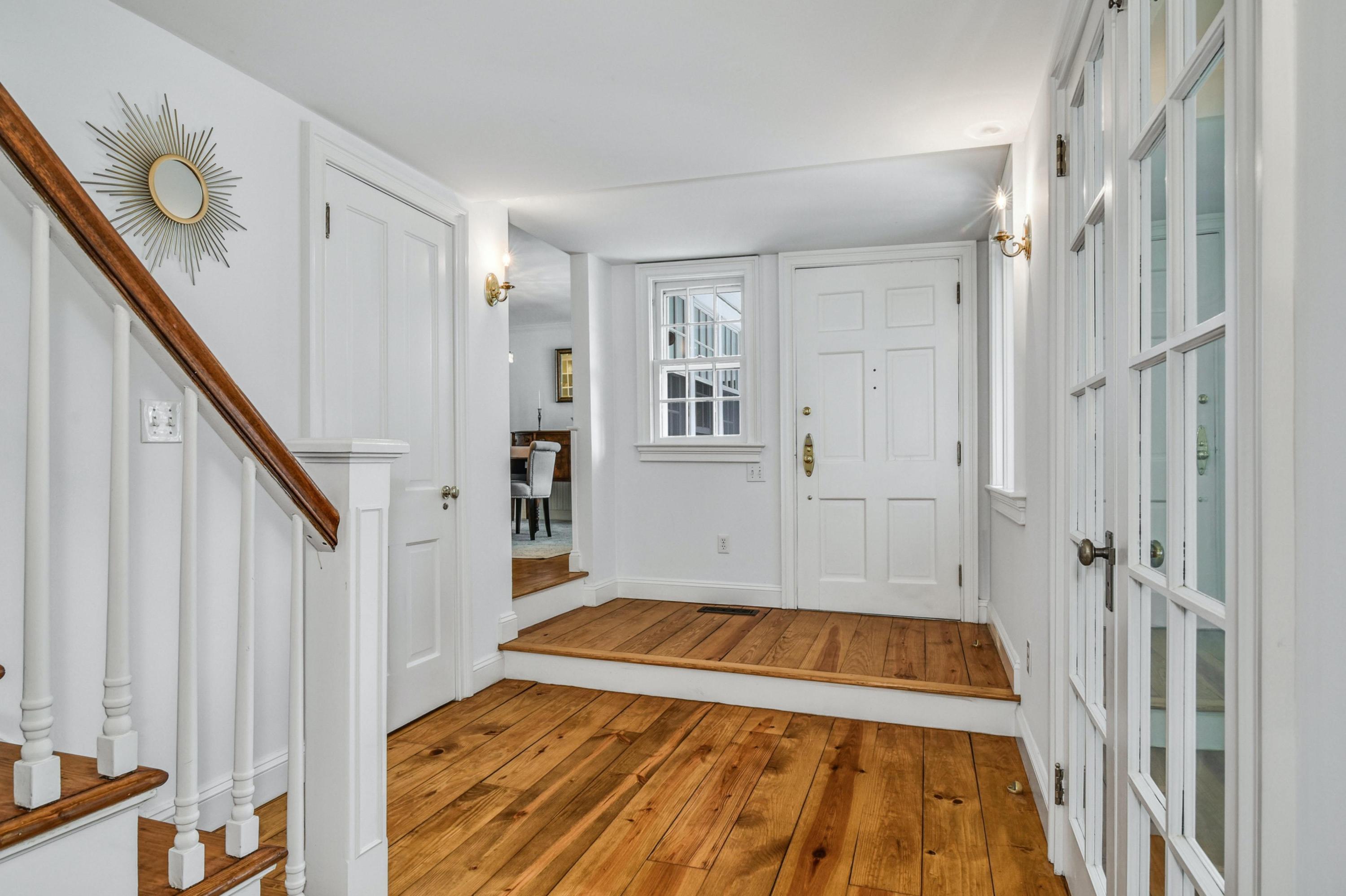 71 Goodwives River Road Darien, CT 06820 - Photo 10 of 39 a view of entryway with wooden floor and stairs
