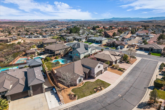 691 Rainier Drive St. George, UT 84770 - Photo 21 of 24 Aerial view of residential area featuring a mountain backdrop