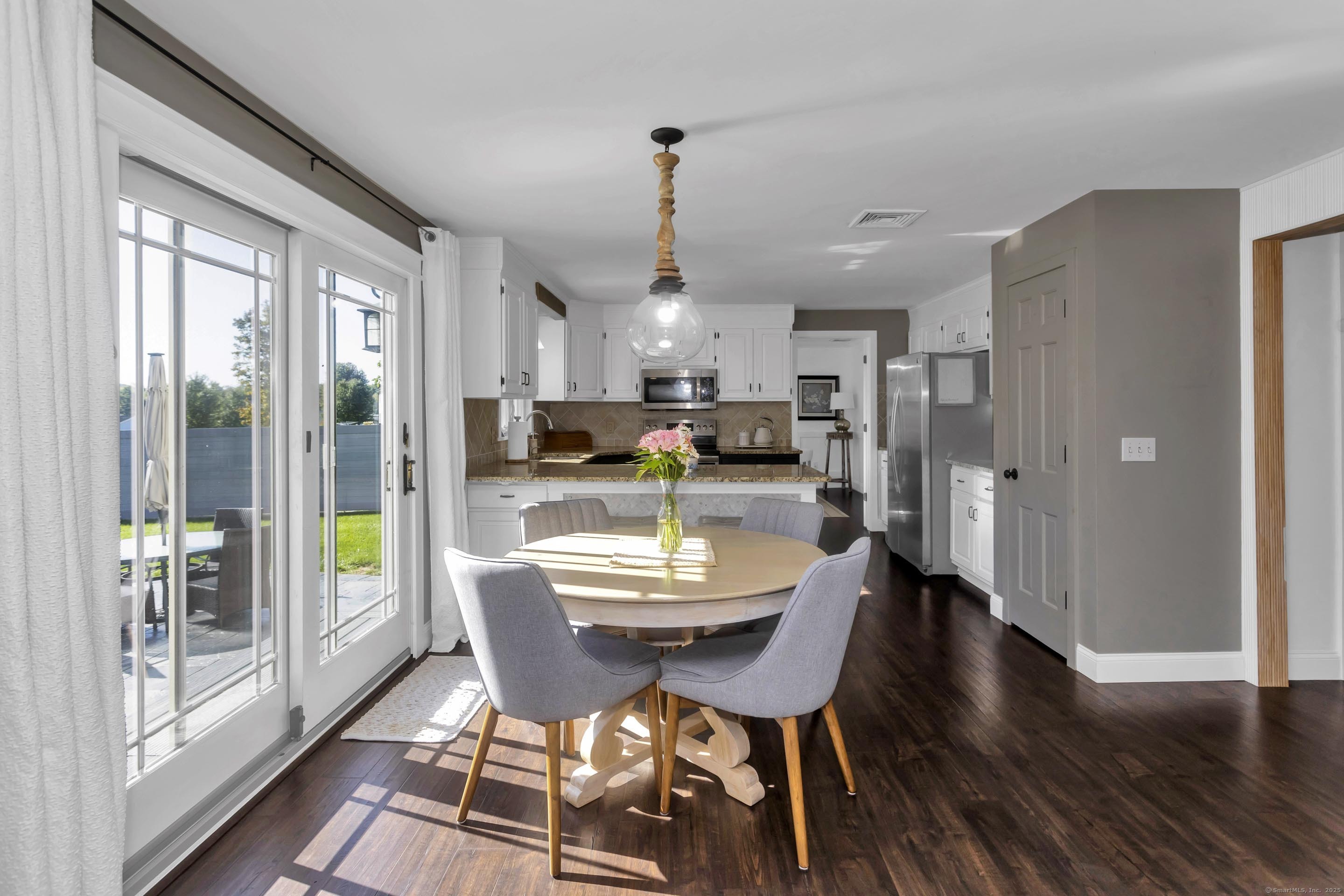 57 Kildeer Lane Suffield, CT 06078 - Photo 12 of 37 a view of a dining room with furniture window and wooden floor