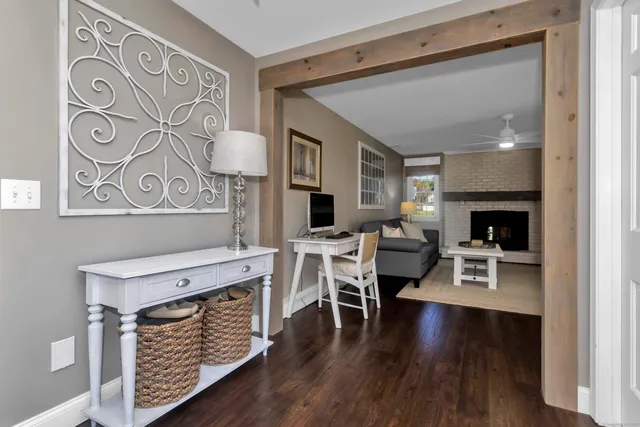 a view of a livingroom with furniture and a fireplace