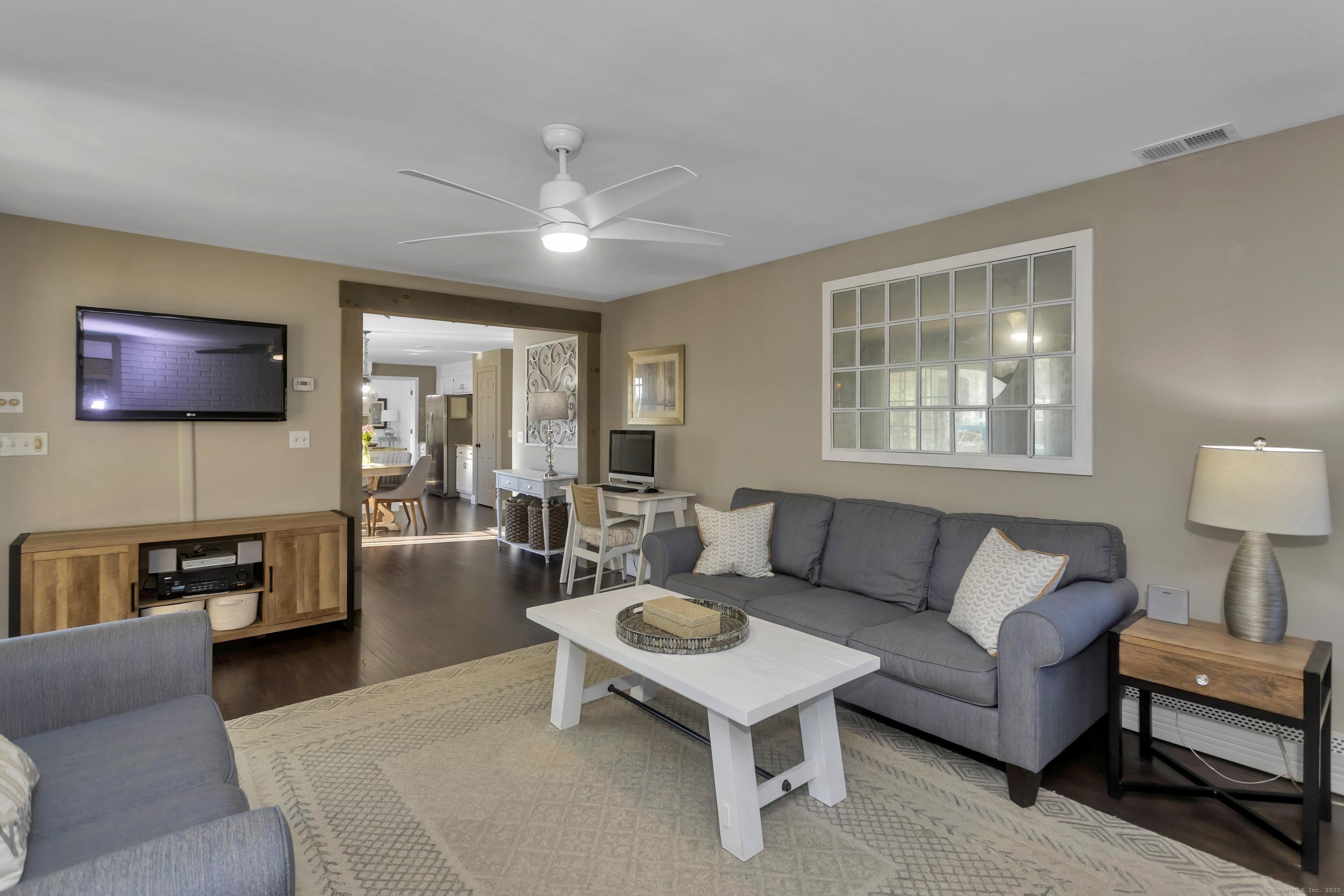 57 Kildeer Lane Suffield, CT 06078 - Photo 15 of 37 a living room with furniture and a flat screen tv