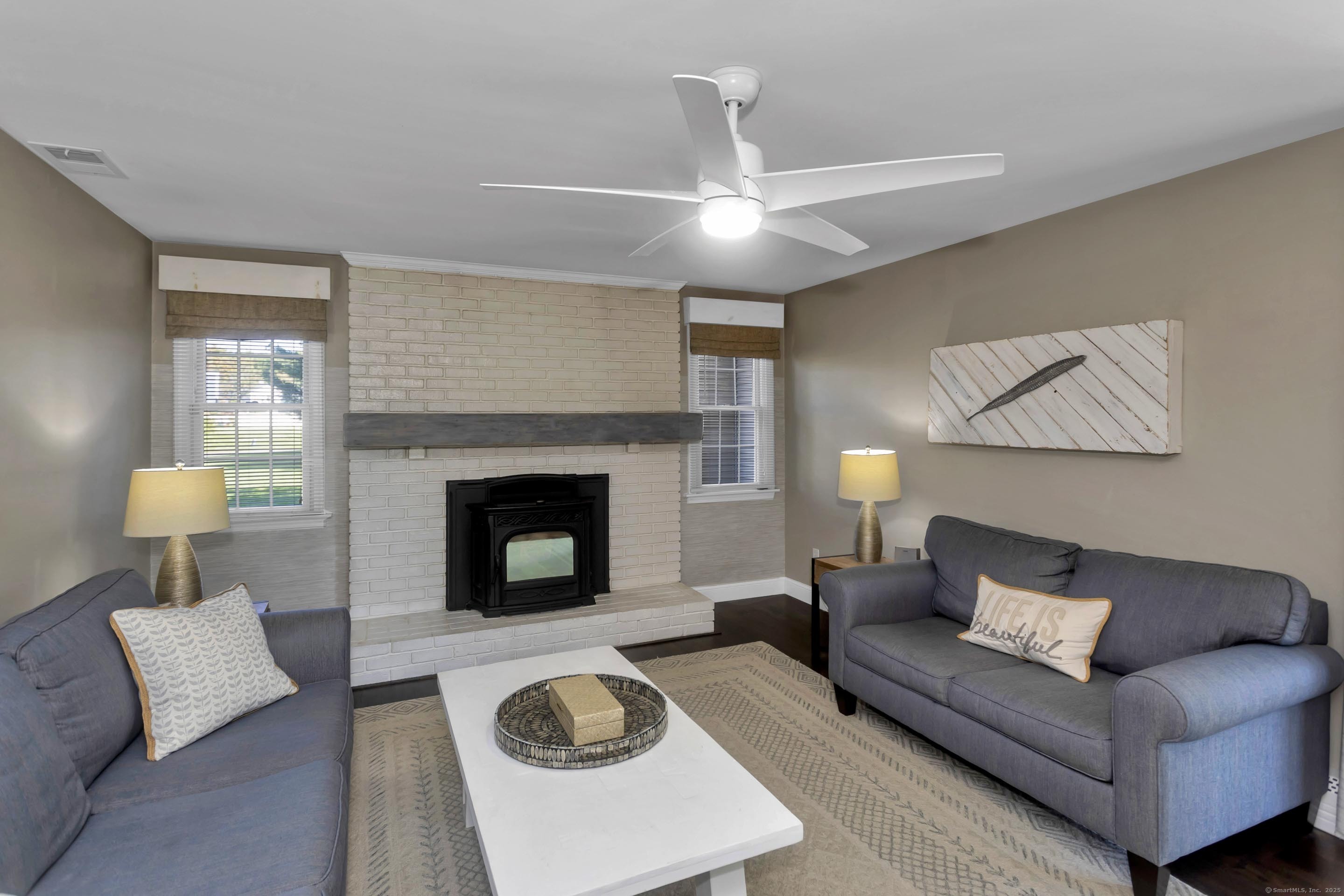 57 Kildeer Lane Suffield, CT 06078 - Photo 17 of 37 a living room with furniture and a fireplace