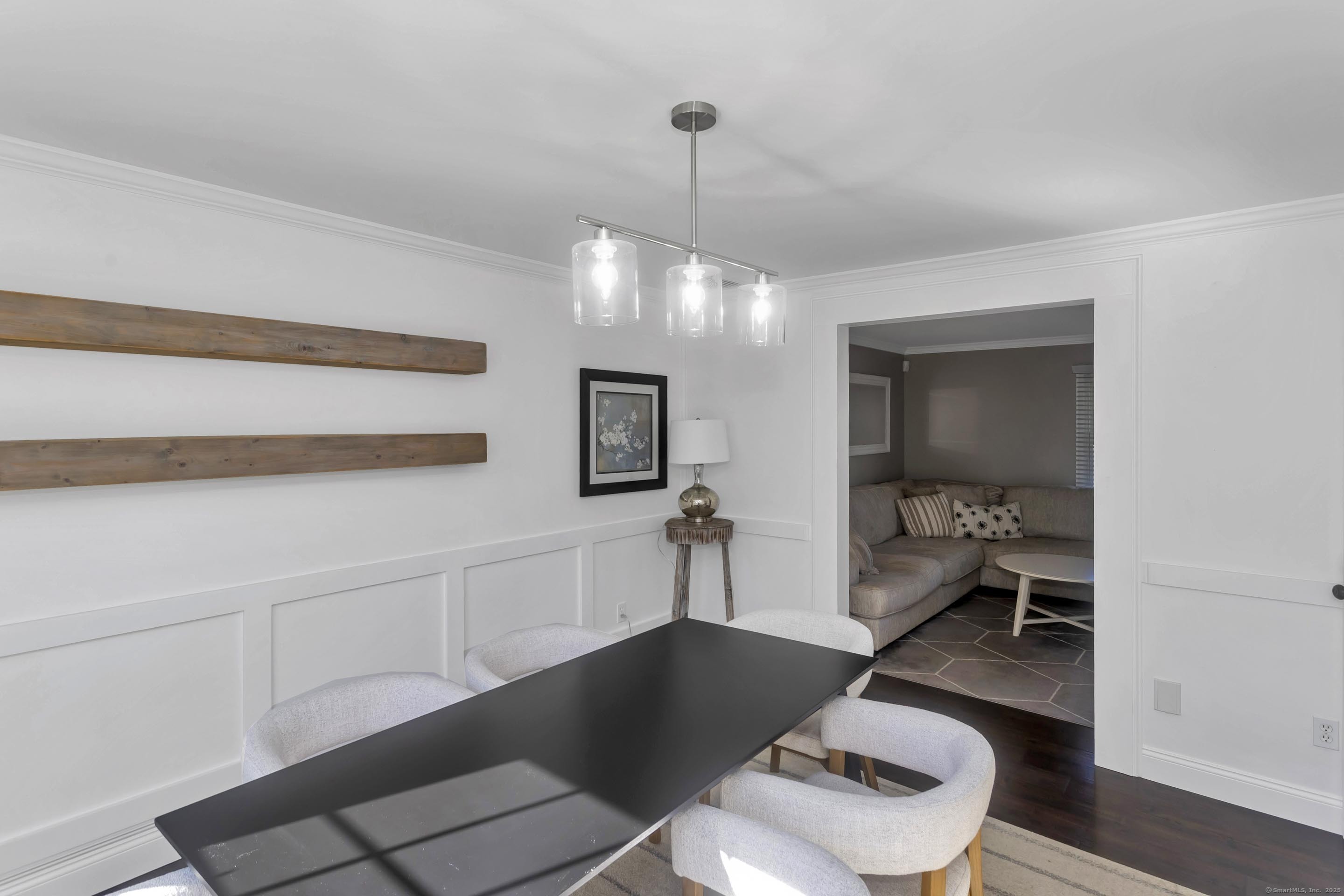 57 Kildeer Lane Suffield, CT 06078 - Photo 20 of 37 a room with a table chairs and a chandelier