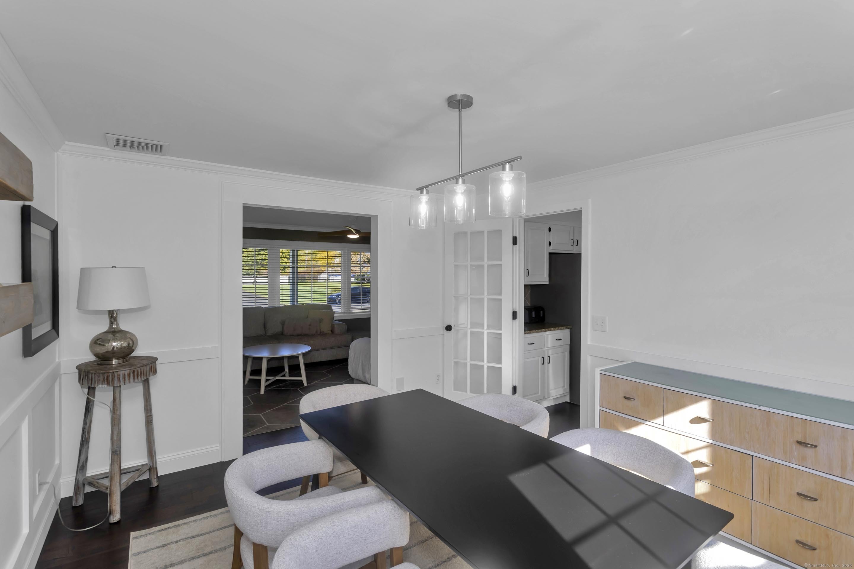 57 Kildeer Lane Suffield, CT 06078 - Photo 21 of 37 a living room with furniture and a chandelier