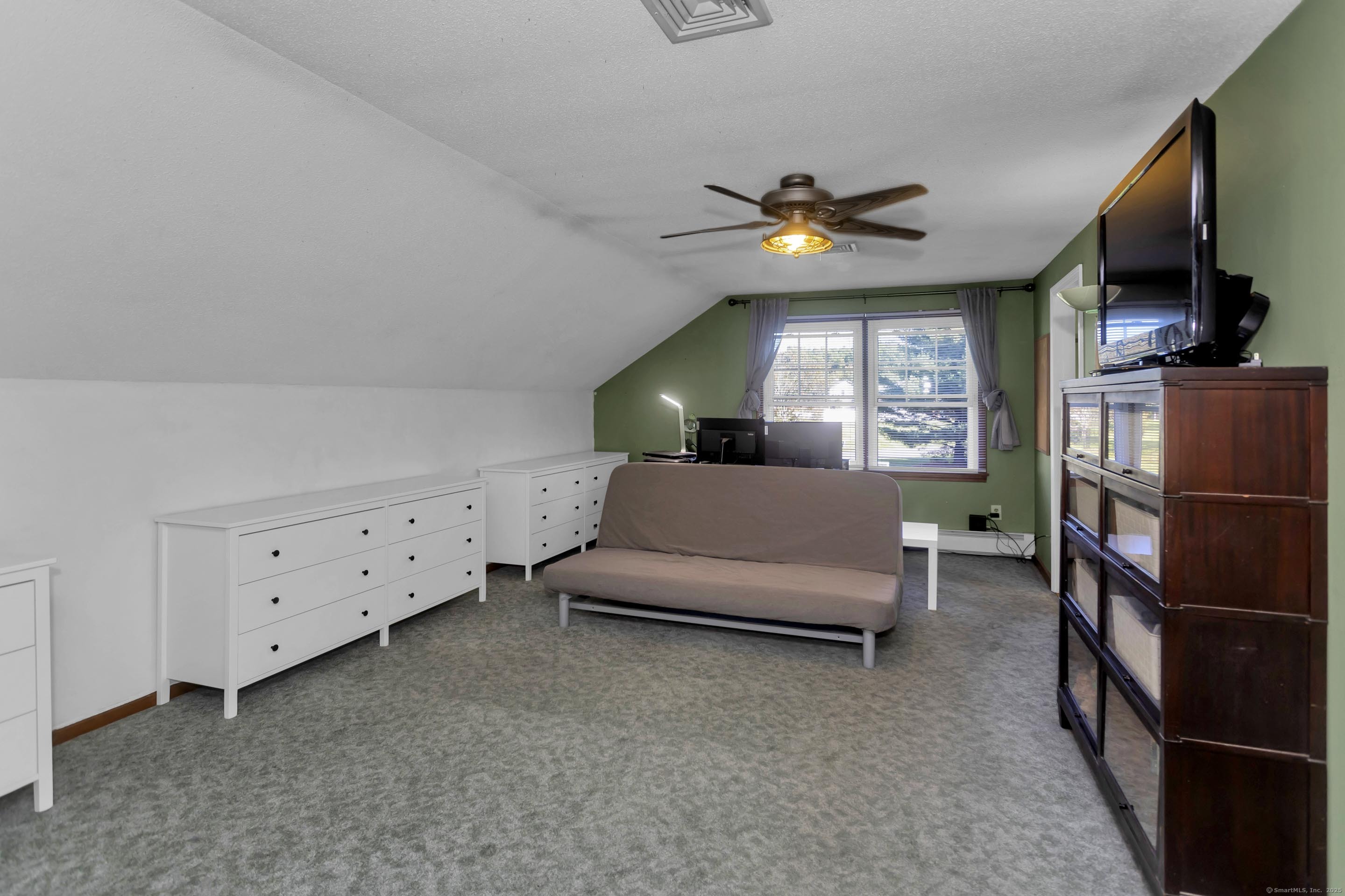 57 Kildeer Lane Suffield, CT 06078 - Photo 28 of 37 a living room with furniture and a flat screen tv