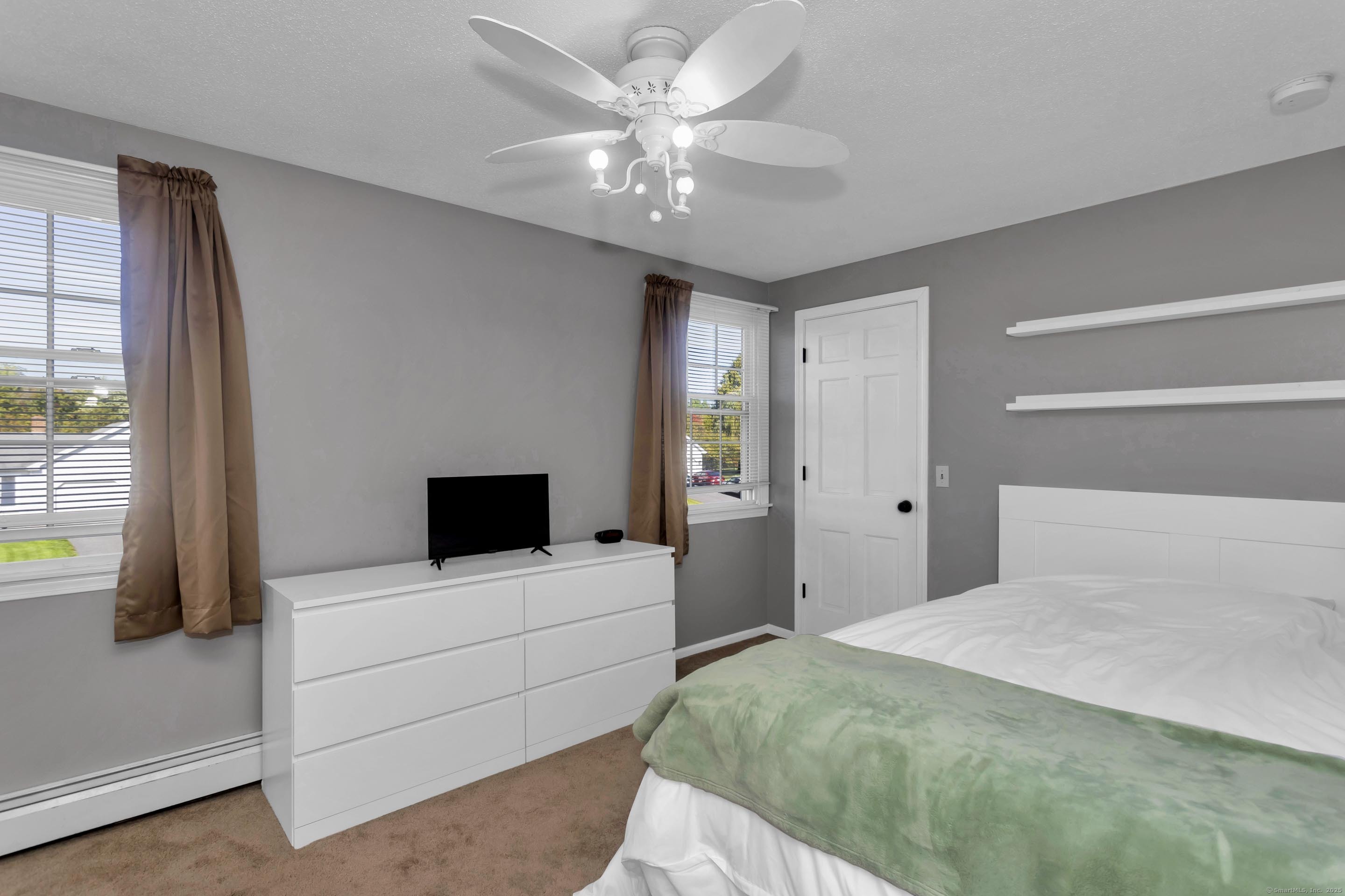 57 Kildeer Lane Suffield, CT 06078 - Photo 35 of 37 a bedroom with a bed and a large window