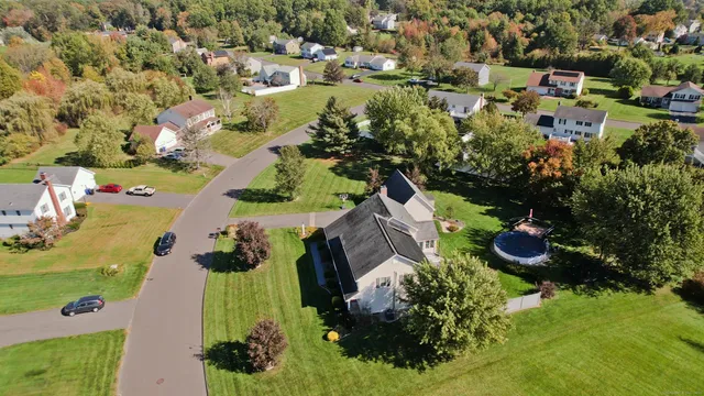 an aerial view of residential houses with outdoor space