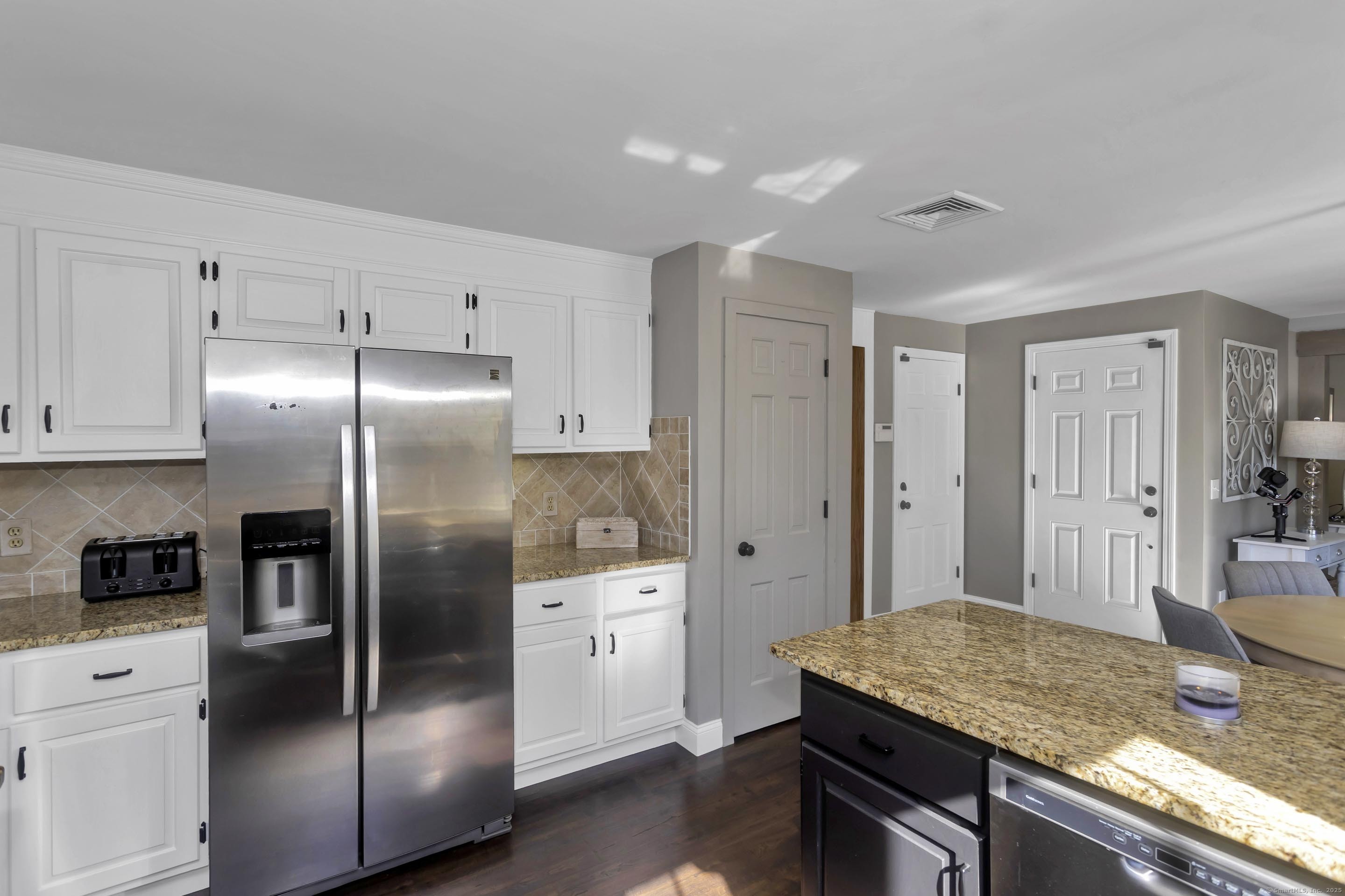 57 Kildeer Lane Suffield, CT 06078 - Photo 8 of 37 a kitchen with granite countertop a refrigerator and stove