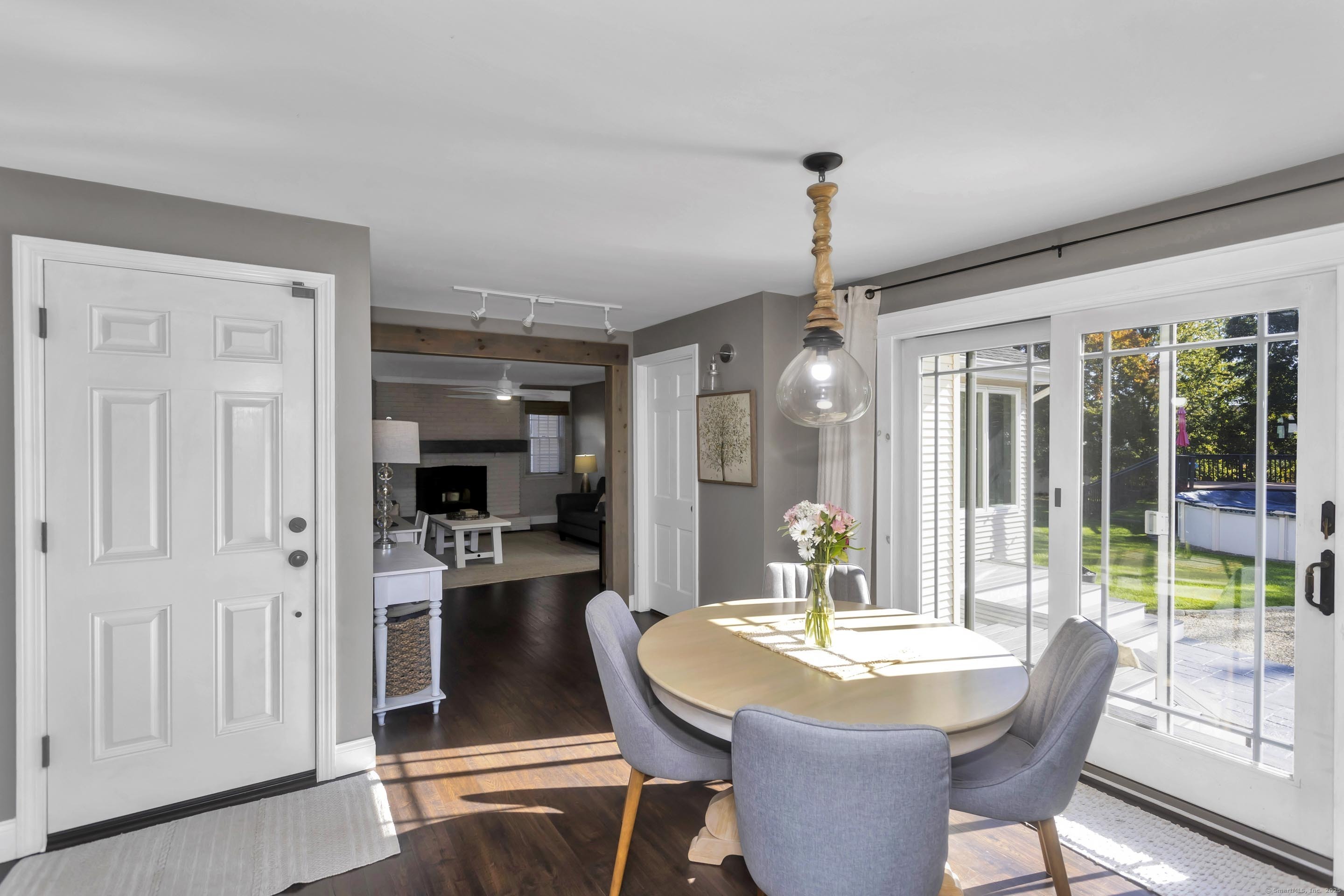 57 Kildeer Lane Suffield, CT 06078 - Photo 10 of 37 a dining room with furniture a chandelier and wooden floor