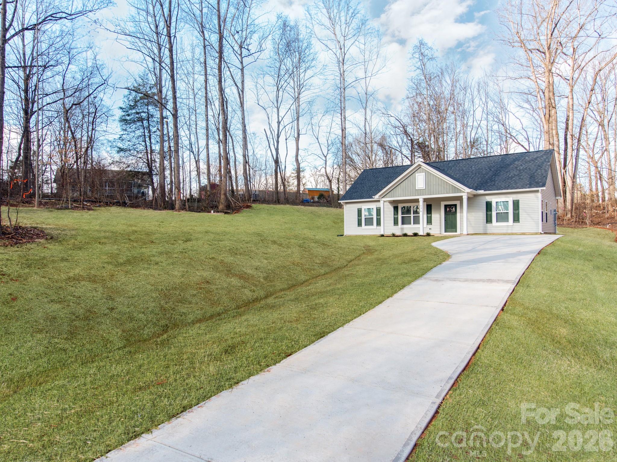 176 Whitetail Road Statesville, NC 28625 - Photo 22 of 23 a front view of a house with a yard