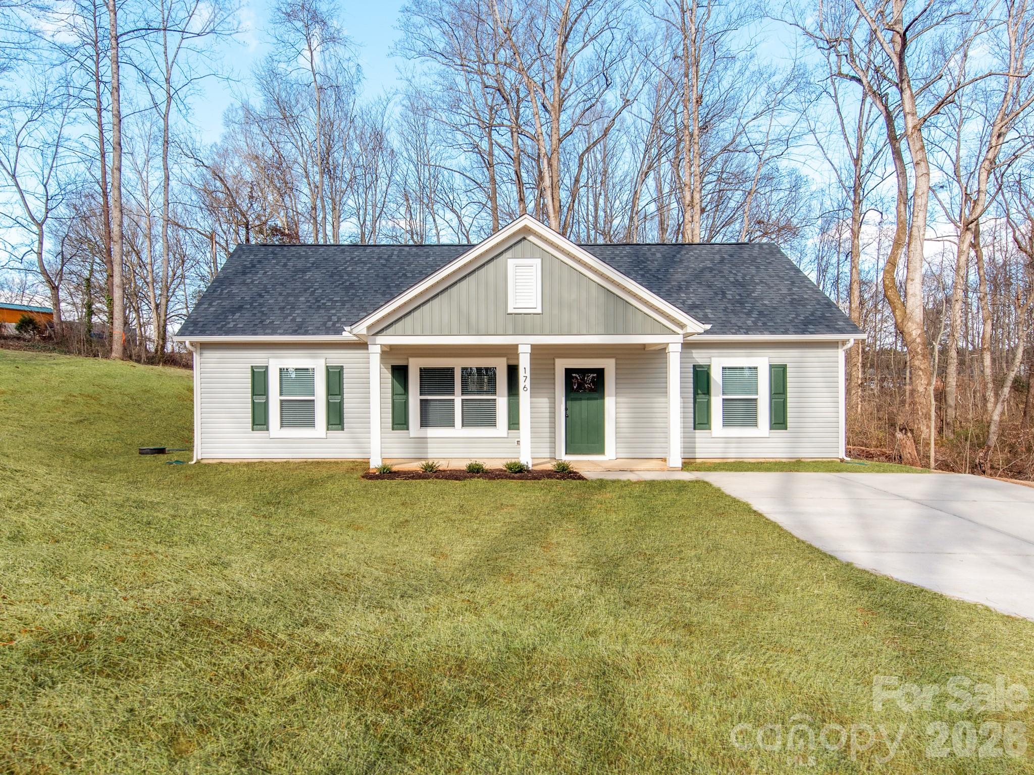 176 Whitetail Road Statesville, NC 28625 - Photo 23 of 23 a front view of a house with a garden