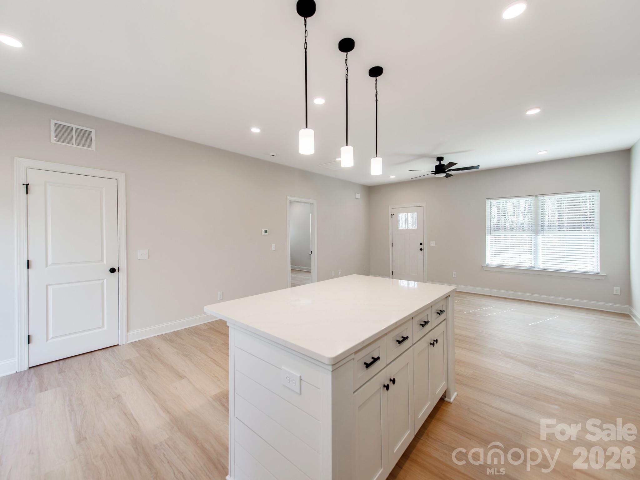 176 Whitetail Road Statesville, NC 28625 - Photo 10 of 23 a kitchen with a sink chandelier and a stove