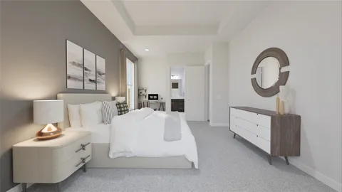 a spacious bedroom with a bed a mirror and lamp