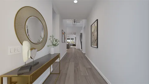 a view of a hallway with wooden floor and a potted plant