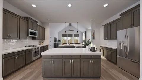 a kitchen with a sink stainless steel appliances and cabinets