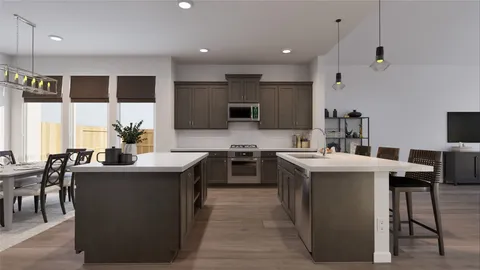 a kitchen with kitchen island stainless steel appliances a sink stove and oven