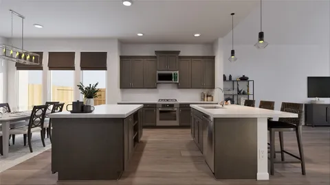 a kitchen with kitchen island stainless steel appliances a sink stove and oven