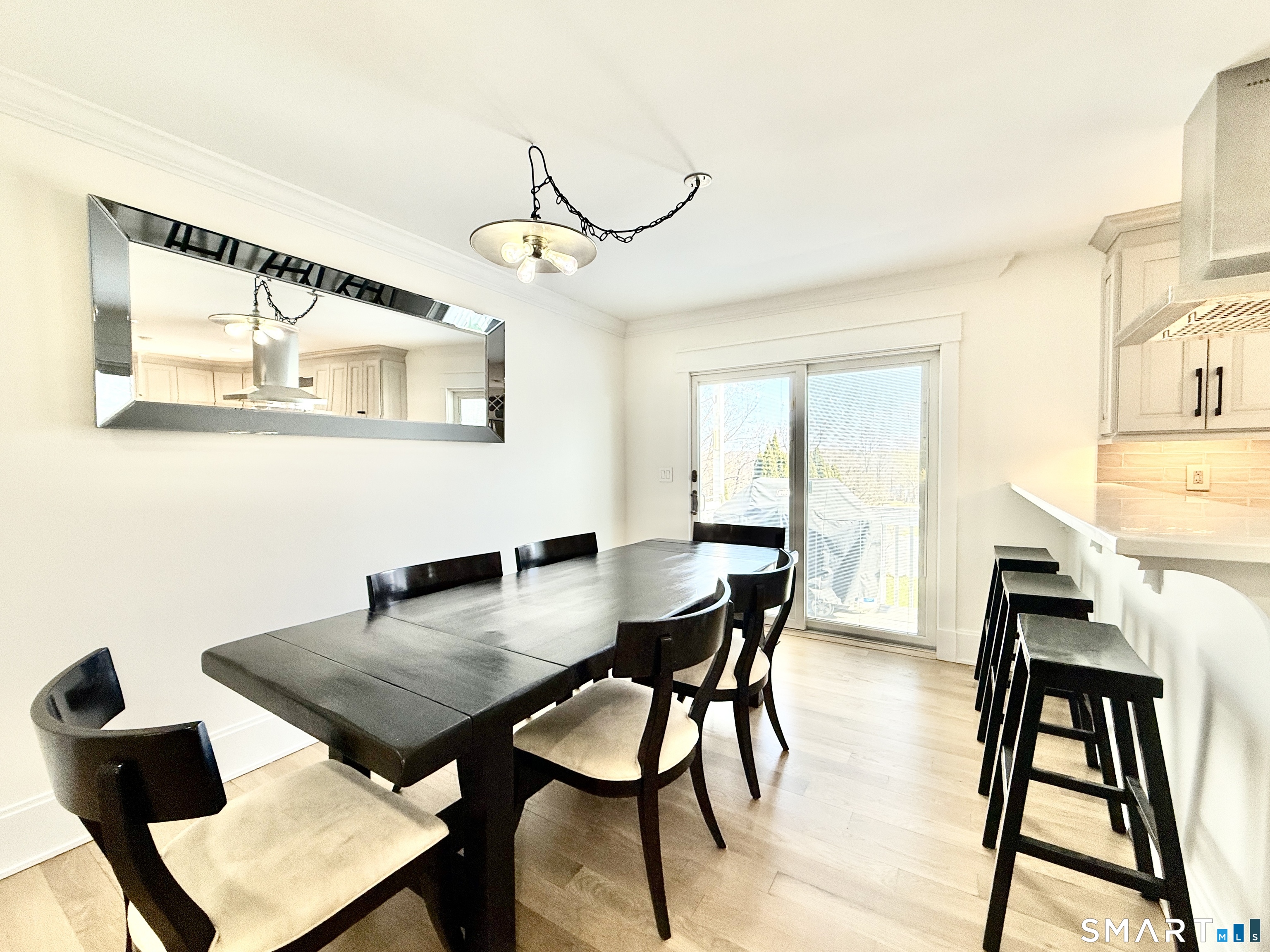 49 Spring Hill Avenue Norwalk, CT 06850 - Photo 10 of 27 Dining Area Leads to Private Deck + Lawn
