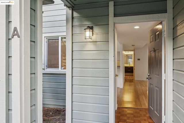 a bathroom with a glass shower door and a bathroom