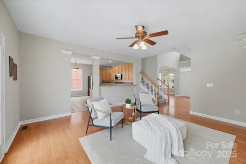 a bedroom with furniture and a wooden floor