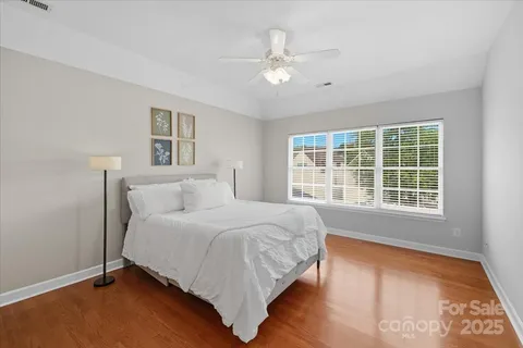 a spacious bedroom with a large bed and a window