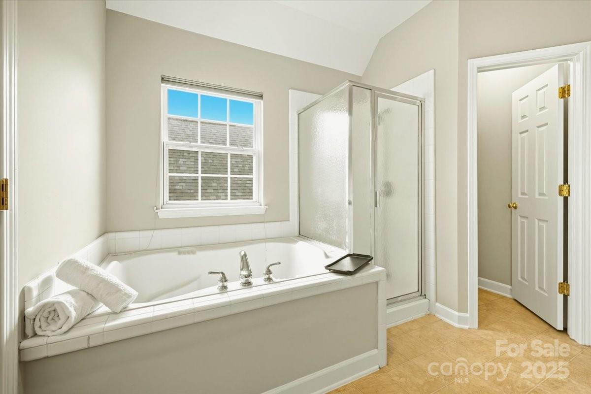 17005 Carlton Way Road Huntersville, NC 28078 - Photo 22 of 45 a bathroom with a tub and a window