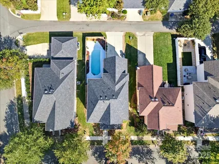 an aerial view of multiple houses with outdoor space