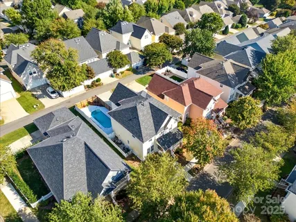 an aerial view of multiple houses with yard