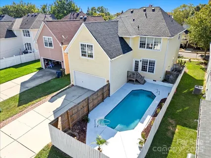 an aerial view of a house with swimming pool