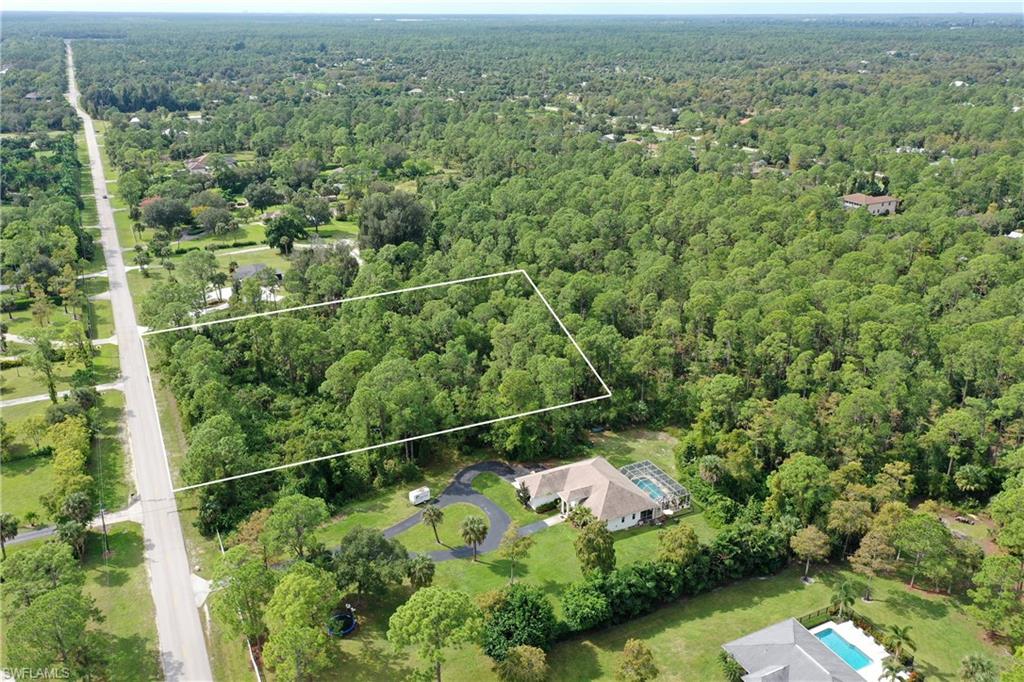 25 St Sw Naples Naples, FL 34117 - Photo 2 of 12 an aerial view of a houses with a yard