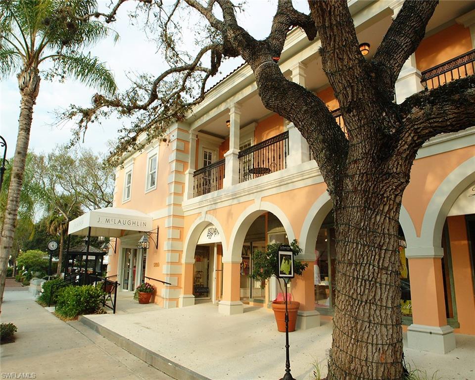 25 St Sw Naples Naples, FL 34117 - Photo 8 of 12 a view of a white house with large trees