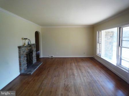 725 Milldam Road Towson, MD 21286 - Photo 8 of 21 wooden floor in an empty room with a window