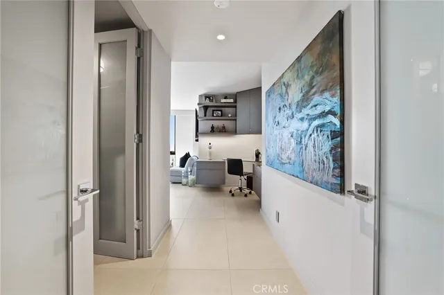 a view of a hallway with furniture and a livingroom view